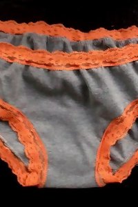 an vaginas of a chick with dark-hued tights and high high-heeled slippers on